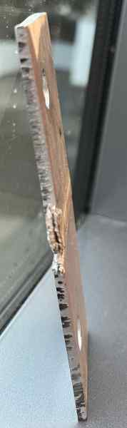 A welded plate seen from the side